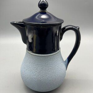 Ceramic teapot with a simple, elegant design.